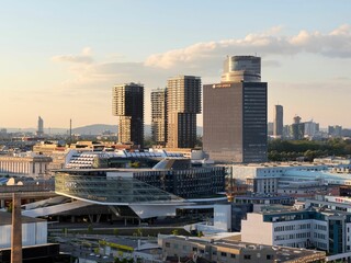 Vienna skyline at sunset with modern skyscrapers.