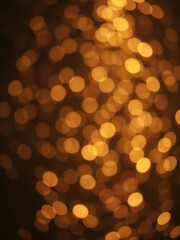 Dark gold and black defocused glitter lights, bokeh effect, festive backdrop, lights, festive
