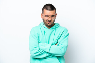 Young caucasian man isolated on white background with unhappy expression