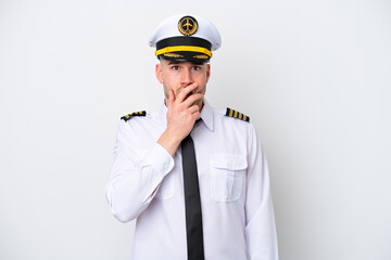 Airplane caucasian pilot isolated on white background surprised and shocked while looking right