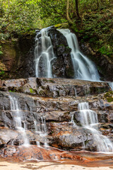 Fototapeta premium A waterfall with a lot of water coming out of it