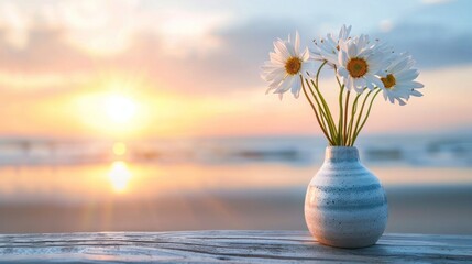 A bouquet of fresh flowers rests in a lovely vase on a wooden table with a sunset beach view