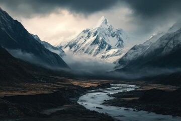 Obraz premium Majestic snow capped peak overlooking a valley river