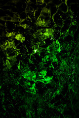 Obraz premium Abstract green water texture with bubbles creating a mesmerizing natural pattern.