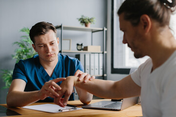 Orthopedic doctor assessing treatment options for a patient during a consultation.