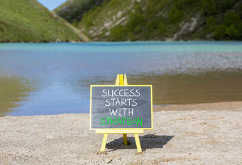 Success starts with strategy symbol. Concept words Success starts with strategy on beautiful...