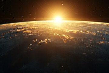 Golden sunlight rises over Earth's horizon, illuminating clouds and ocean in a breathtaking view from space