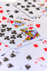 A deck of playing cards with the King of Hearts on top