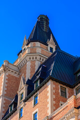 A building with a black roof and a clock on top