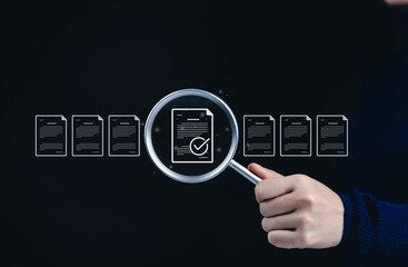Document Review Process and Quality Control Concept. Hand holding magnifying glass focuses a...
