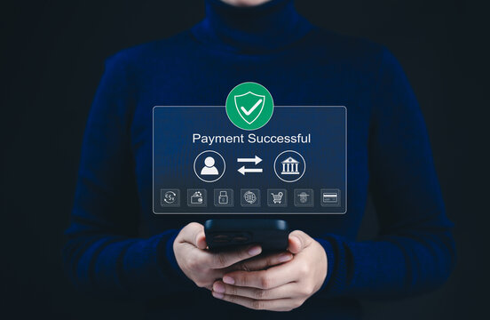 Successful payment confirmation in online digital banking. A person holds smartphone displaying Payment Successful message, with icons representing online transactions, financial technology, fintech,