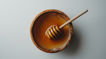 Golden Honey in Wooden Bowl with Honey Dipper