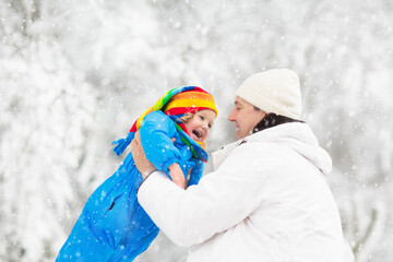 Kids play in snow in winter park