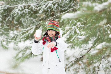 Kids play in snow in winter park