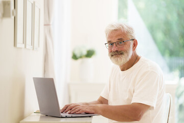 Senior man working on computer