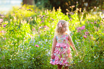 Little girl in flower garden