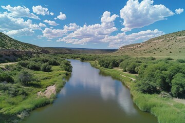 River Valley Landscape Under a Blue Sky with Clouds