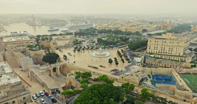 Cityscape of the streets of Valletta Malta, aerial view. The central square of the city on a tourist island in Europe, with ancient architecture and urban. High quality 4k footage
