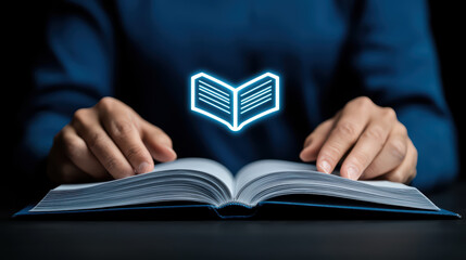 person reading book with glowing icon above it, symbolizing knowledge