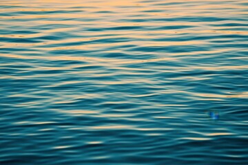 Tranquil View of Soft Blue Water Surface with Gentle Gradient Lighting and Symmetrical Patterns at Dusk, Offering a Peaceful and Serene Atmosphere