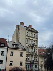 A tall building next to short buildings