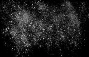 Dry cement, mortar powder scattered isolated on black background, top view	