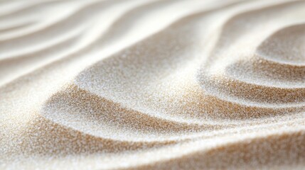 Soft ripples of fine sand under gentle sunlight create a serene backdrop for text