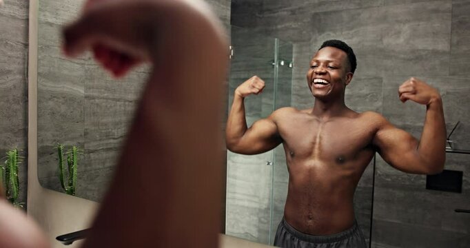 Black man, mirror and bicep flex in bathroom for fitness, results and confidence with progress and abs in home. African person, reflection and strong body for exercise, muscle power and wellness
