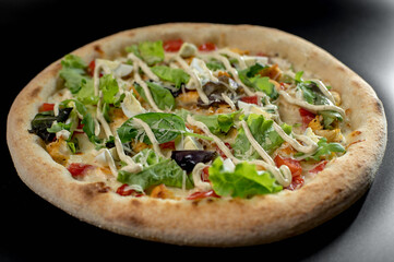 details of the pizza application; juicy pizza from the oven with mushrooms, tomatoes and bacon and sprinkled with parmesan cheese