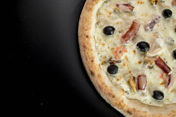 details of the pizza application; juicy pizza from the oven with mushrooms, tomatoes and bacon and sprinkled with parmesan cheese