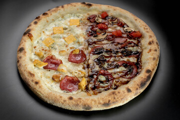 details of the pizza application; juicy pizza from the oven with mushrooms, tomatoes and bacon and sprinkled with parmesan cheese