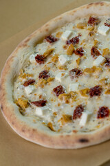 details of the pizza application; juicy pizza from the oven with mushrooms, tomatoes and bacon and sprinkled with parmesan cheese
