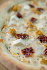 details of the pizza application; juicy pizza from the oven with mushrooms, tomatoes and bacon and sprinkled with parmesan cheese