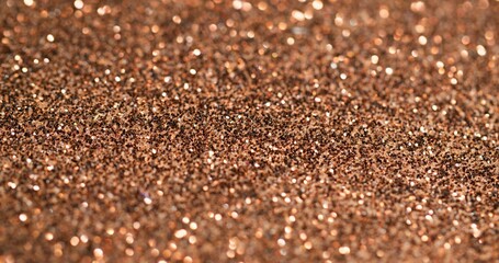 Blur shimmering. Golden glitter. Light festive surface with fine metallic dust. Color precious decoration shining glamour particles.