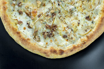 details of the pizza application; juicy pizza from the oven with mushrooms, tomatoes and bacon and sprinkled with parmesan cheese
