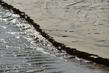water tracks in the sand