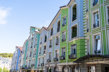 Blue green Multicolor modern balconies. Facade of Colorful Houses Buildings. Bright windows architecture. Condominium