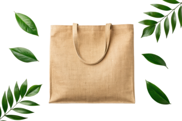 Natural tote bag surrounded by green leaves, cut out - stock png.