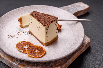 Slice of sweet cheesecake sprinkled with chopped chocolate