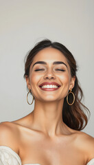 Serene Brunette Woman with Closed Eyes Smiling, Natural Beauty and Joy, Close-up Portrait with Off-Shoulder Top and Gold Hoop Earrings, Peaceful Expression, Glowing Skin and Contentment