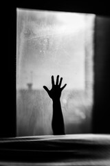 silhouette of a person reaching