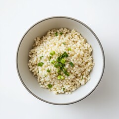 A minimalist bowl of plain millet with a light drizzle of sesame oil and a sprinkle of chopped scallions, served in a simple white ceramic bowl, Millet centered