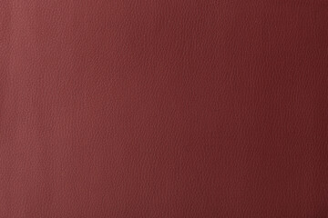 Texture of genuine leather, artificial leatherette red background