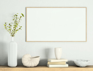 Mock up poster frame on white plaster wall with plant in a vase, books, sea shell and geometric object on old wooden table; landscape orientation; stylish frame mock up; 3d rendering, 3d illustration