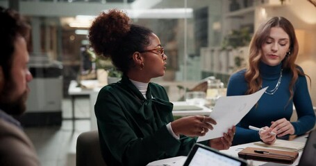 Business people, group and planning in meeting with paper for media press release, pr strategy and brand image. Team, discussion and manager giving document on overtime in creative startup at night