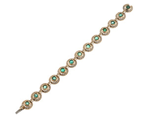 yellow gold and emerald bracelet. isolated white background