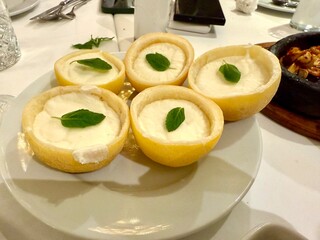Lemon sorbet ice cream with peel served at plate