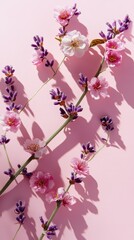 Naklejka premium Light pink banner with cherry blossoms and lavender flat lay design