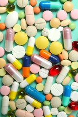 Various pills on a colored background