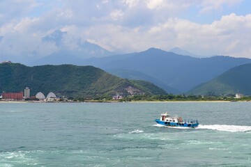 Fototapeta premium Coastal Scene with Boat and Dome Structure in Taiwan
